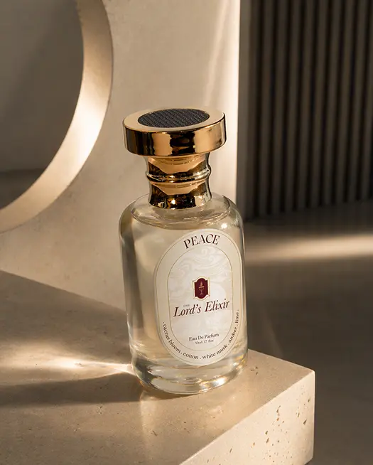 Elegant perfume bottle labeled Lord's Elixir on stone surface