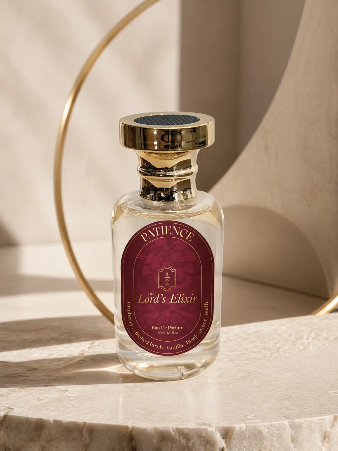Clear glass perfume bottle with gold cap